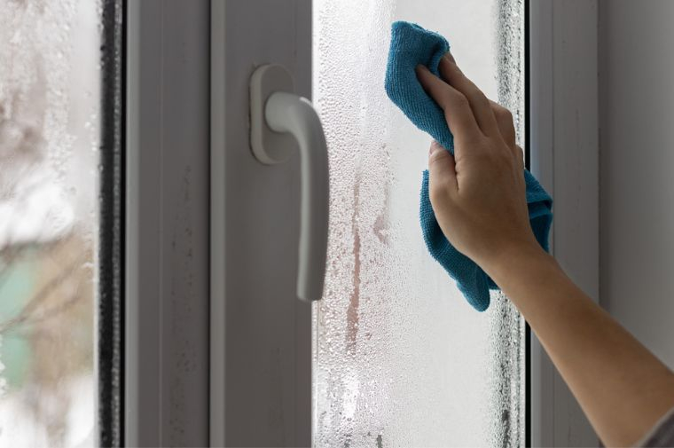 Customer wiping window with a cloth