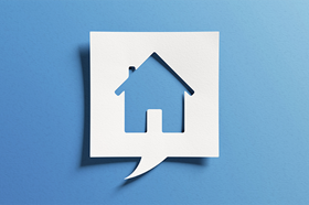 White speech bubble on blue background with house cut out